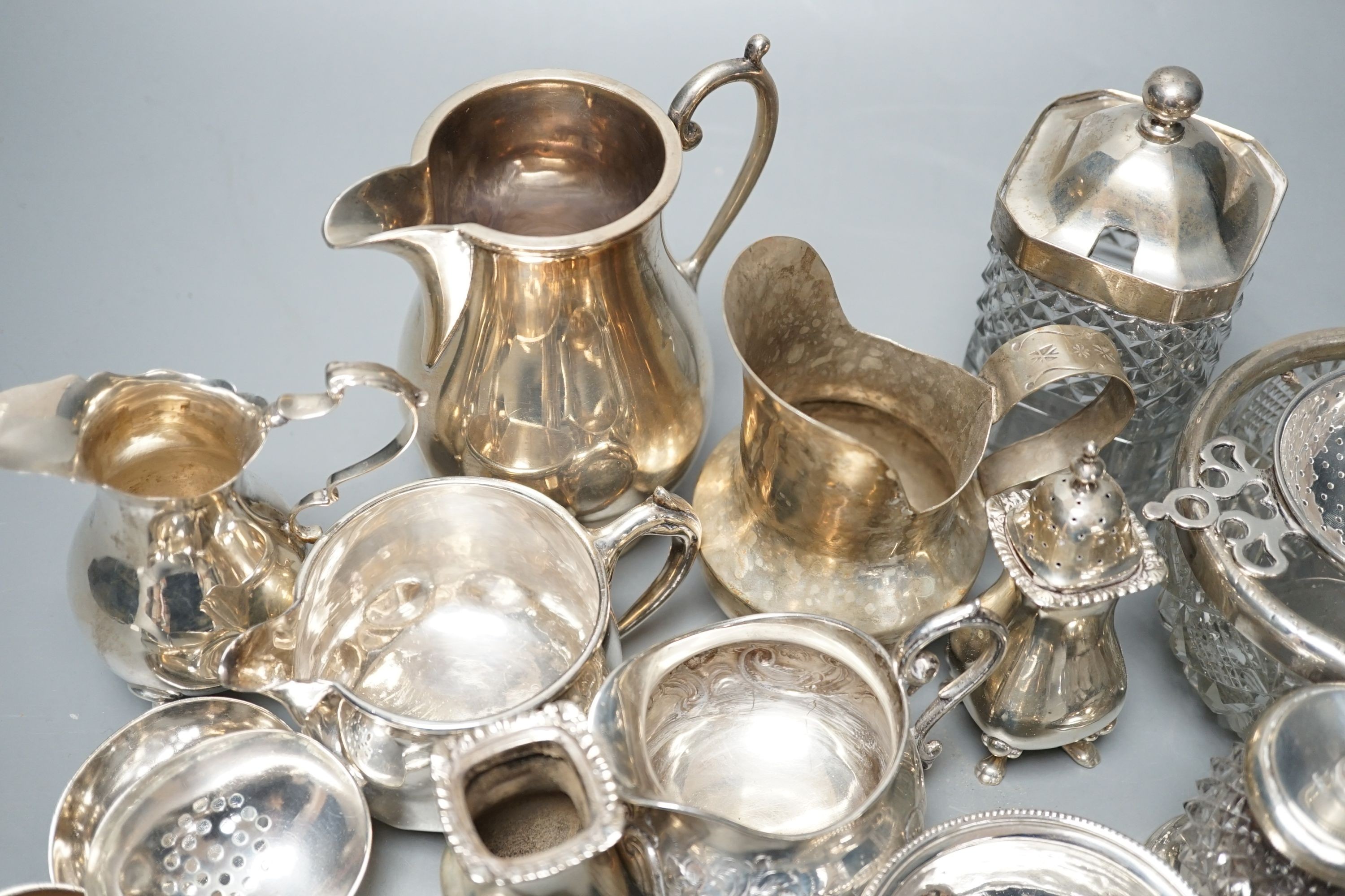 A mixed collection of small silver and sterling items, to include five assorted small ladles, cream jugs, Georgian mustard, bowls etc.